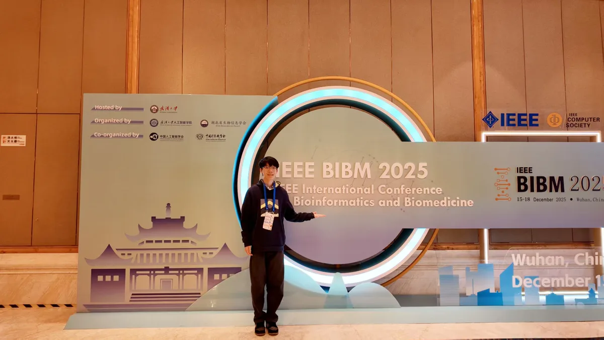Tao Xie at the IEEE BIBM 2025 conference display